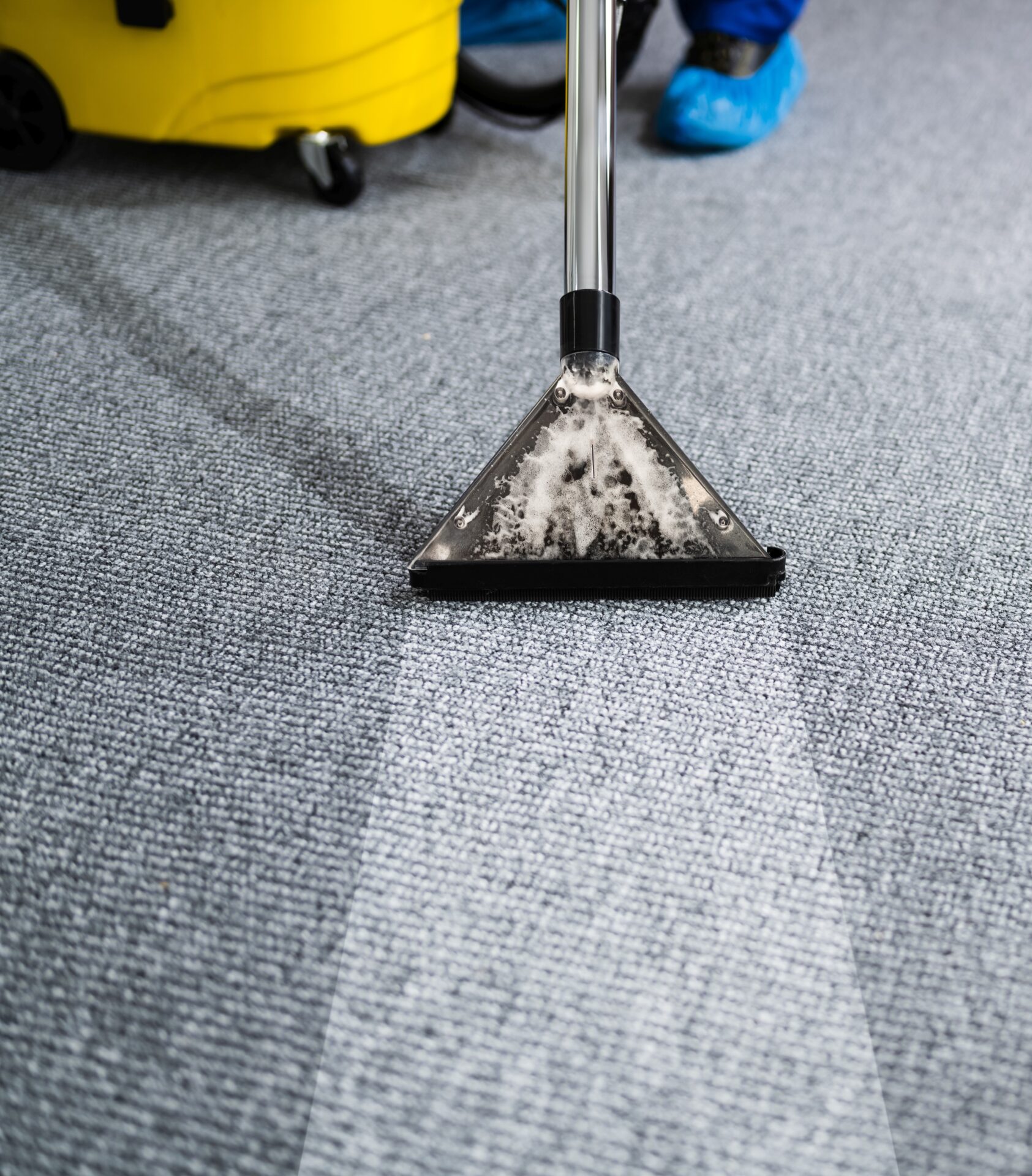 Worker with cleaning tools